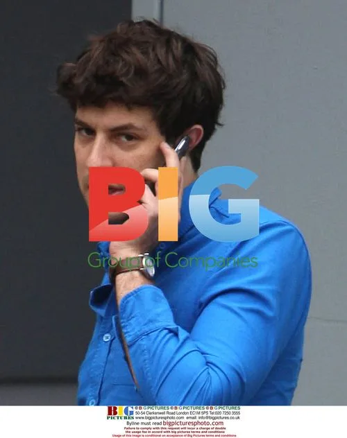 Musician Mark Ronson with girlfriend at hotel