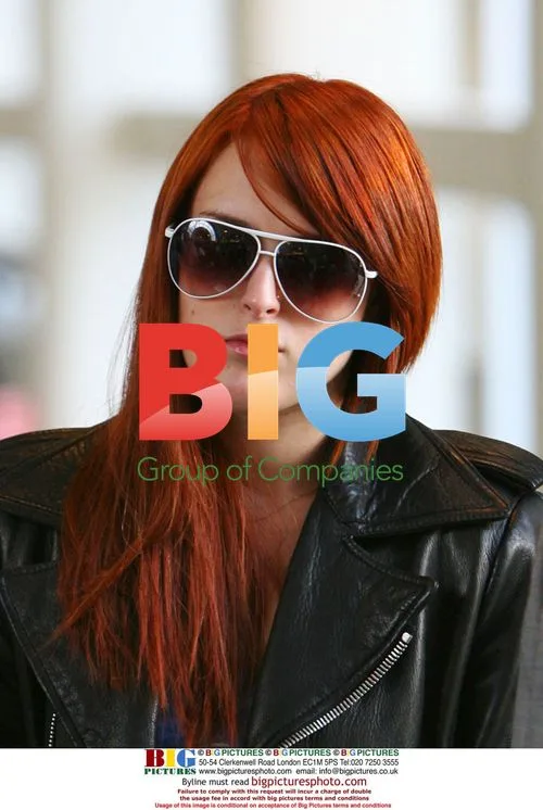 Rumer Willis departs LAX with red hair