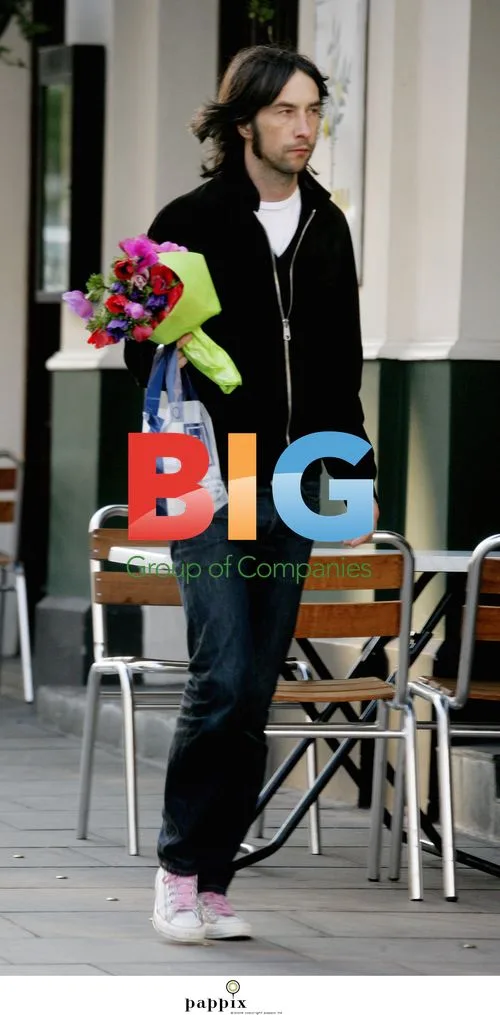 Bobbie Gillespie Holding Flowers in London
