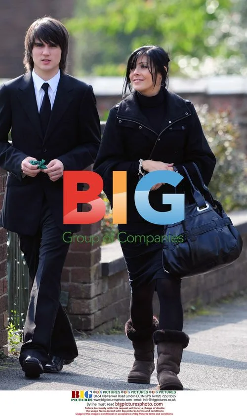 Kim Ryder filming Liam Connor's funeral