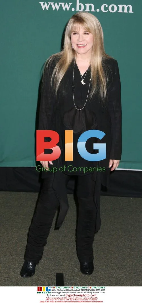 Stevie Nicks poses with fans at DVD release