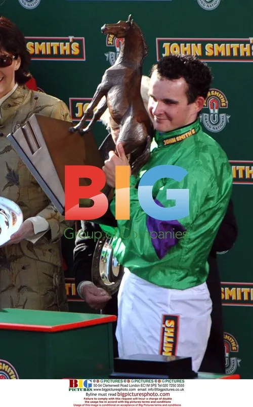 Jockey Liam Treadwell with Grand National prize