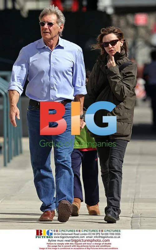 Harrison Ford and Calista Flockhart walk with son