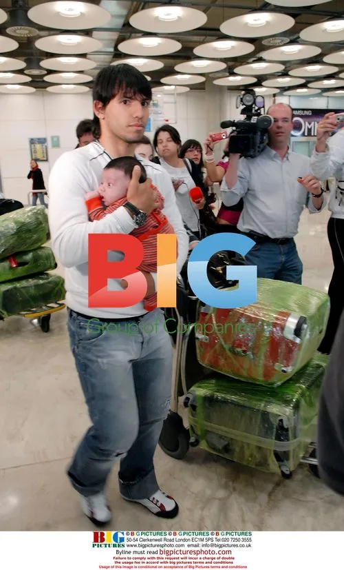 Sergio Aguero and Giannia Maradona with baby