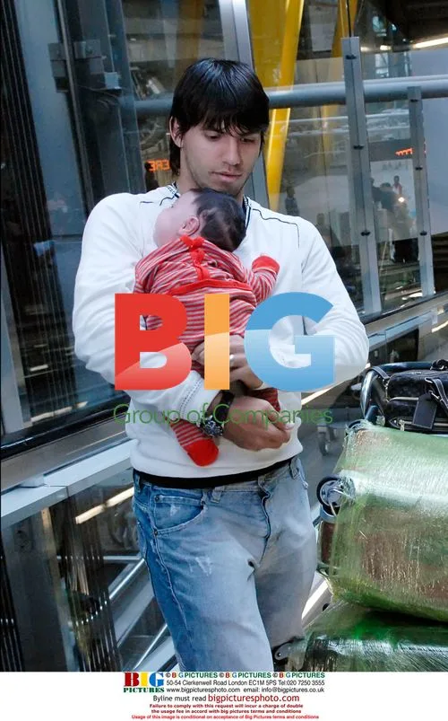 Sergio Aguero and Giannia Maradona with baby