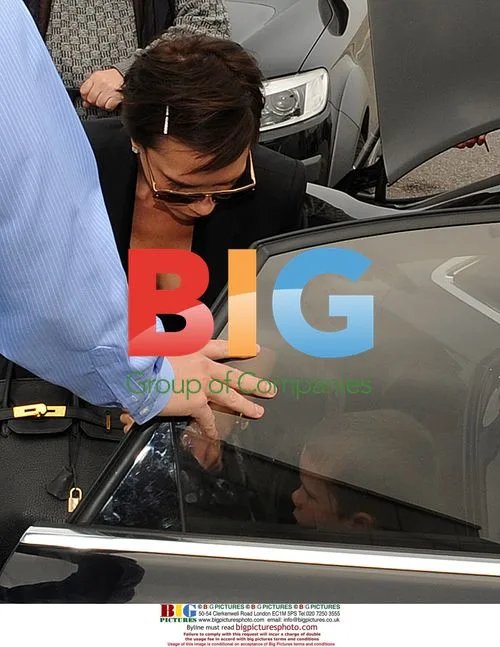 Victoria Beckham and sons at Milan airport