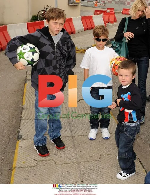 Victoria Beckham and sons at Milan airport