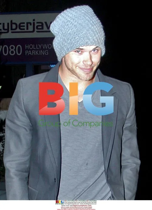 Kellan Lutz runs into banana-dressed photographer