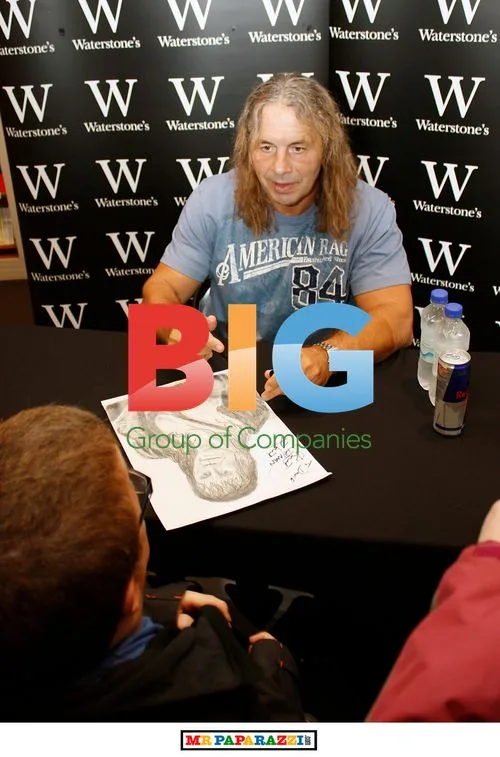 Wrestling legend Bret "HITMAN" Hart signs book