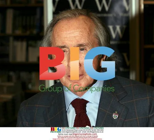 Jackie Stewart signs 'Winning Is Not Enough' book