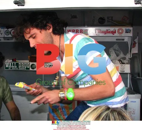 Mika hands out wristbands and ice cream