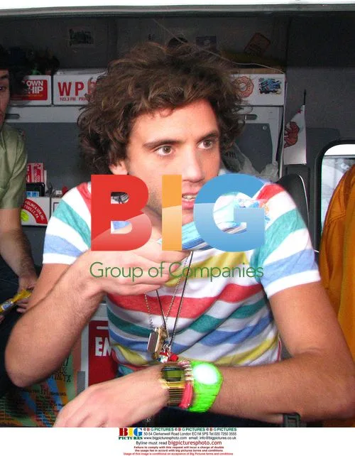 Mika handing out wristbands and ice cream