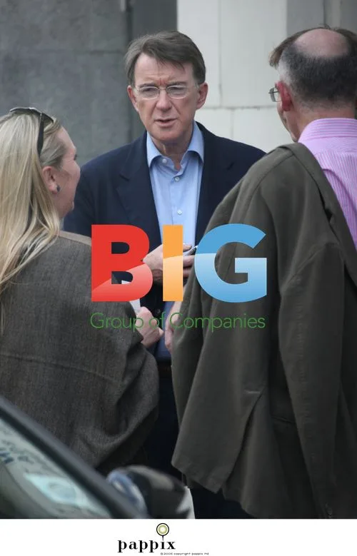 Peter Mandelson checks phone before cinema