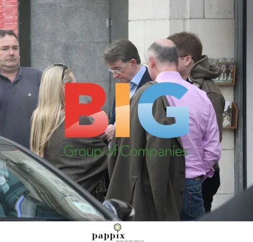 Peter Mandelson checks mobile phone in Notting Hill