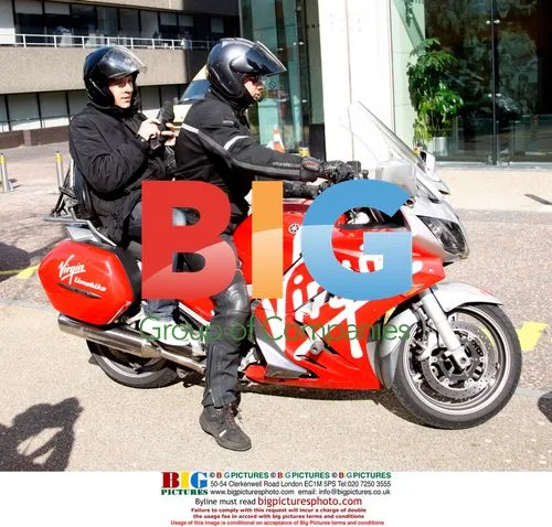 Ben Shepard leaving GMTV studios on Virgin bike