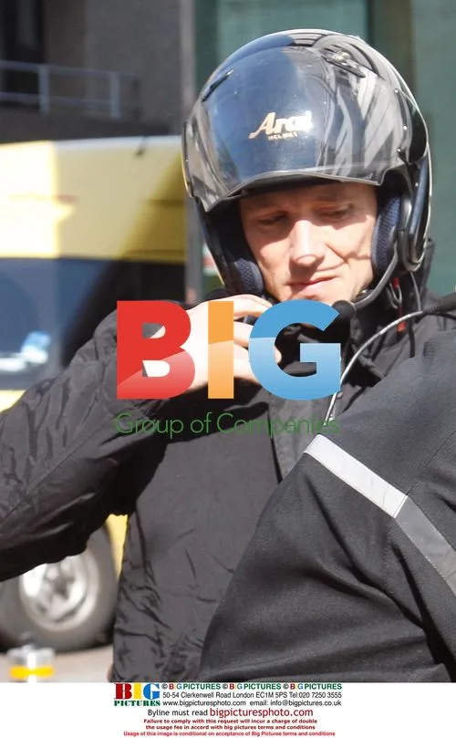 Ben Shepard leaving GMTV studios on Virgin taxi bike