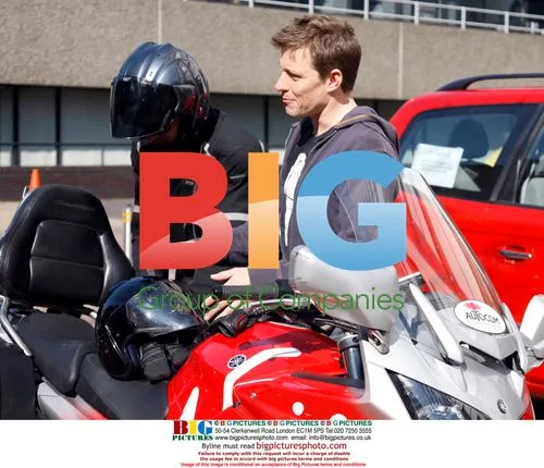 Ben Shepard leaving GMTV studios on a bike
