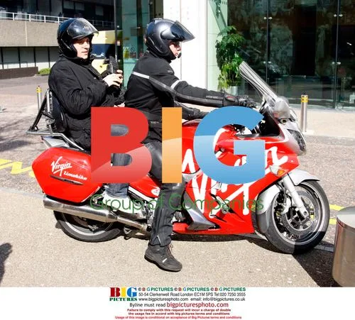 Ben Shepard leaving GMTV studios on a Virgin taxi bike