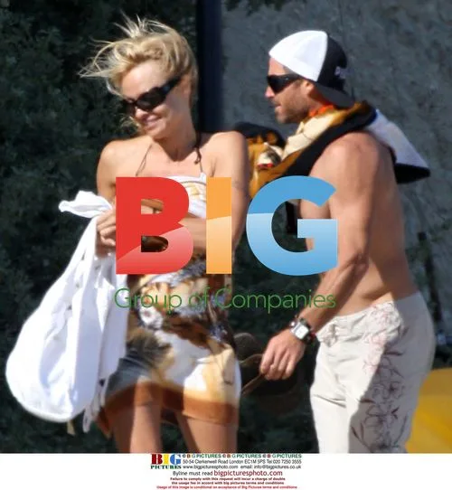 Pamela Anderson sunbathes in white bikini