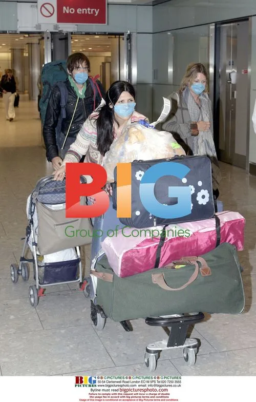 Passengers arrive home from Mexico City