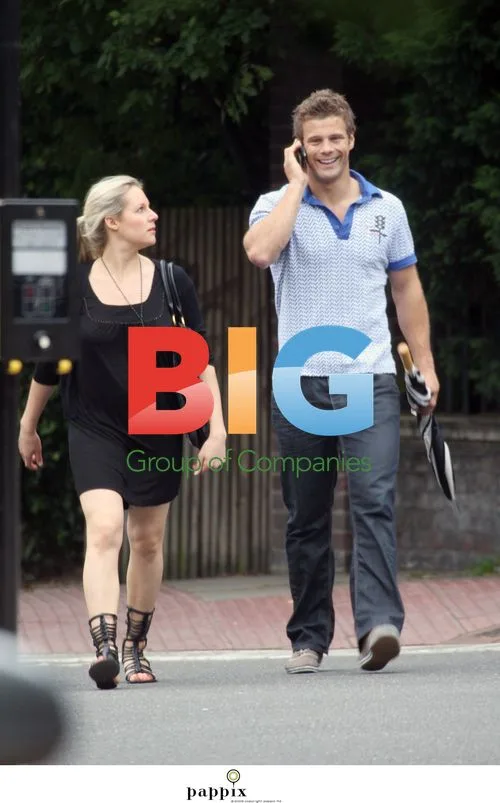 Abigail Titmuss and Male Companion Stroll in London