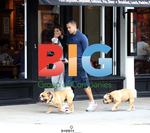 Joe Cole and Carly Cole walking dogs
