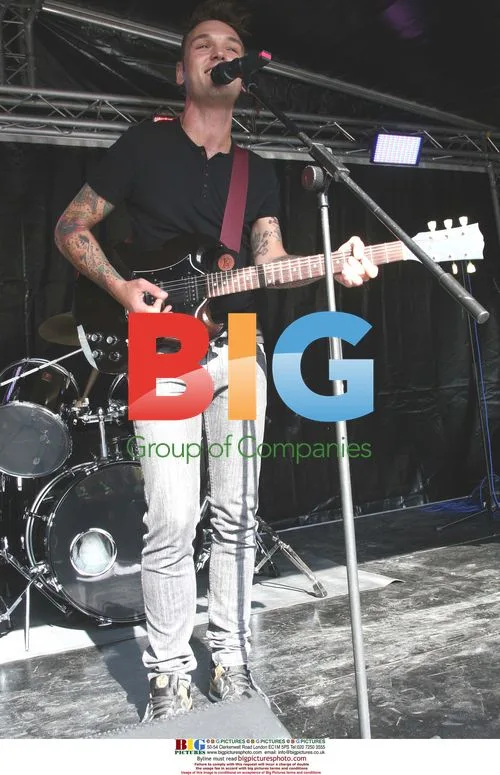 Samuel Preston performs solo onstage at Pennine FM roadshow