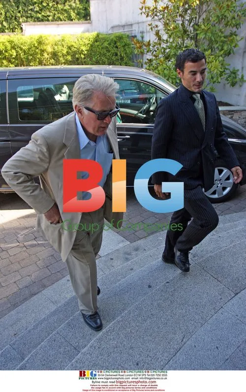 Martin Sheen and son Emilio Estevez meet with businessmen