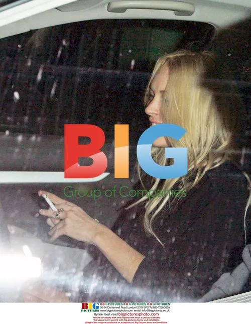 Lindsay Lohan and Samantha Ronson smoke outside restaurant
