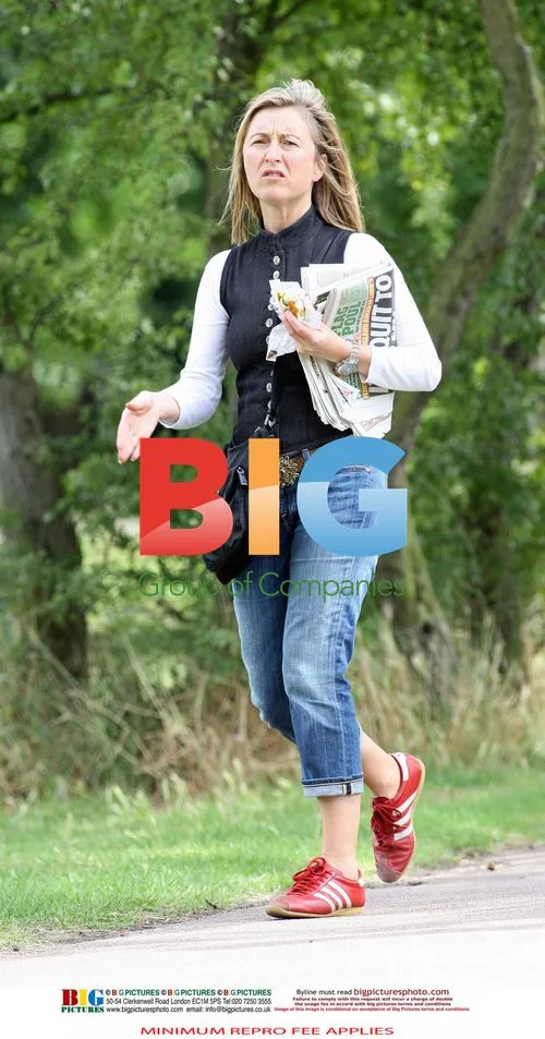 Fiona Phillips buys a newspaper in London