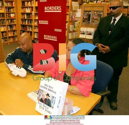 Rev Run and Justine Simmons at book signing