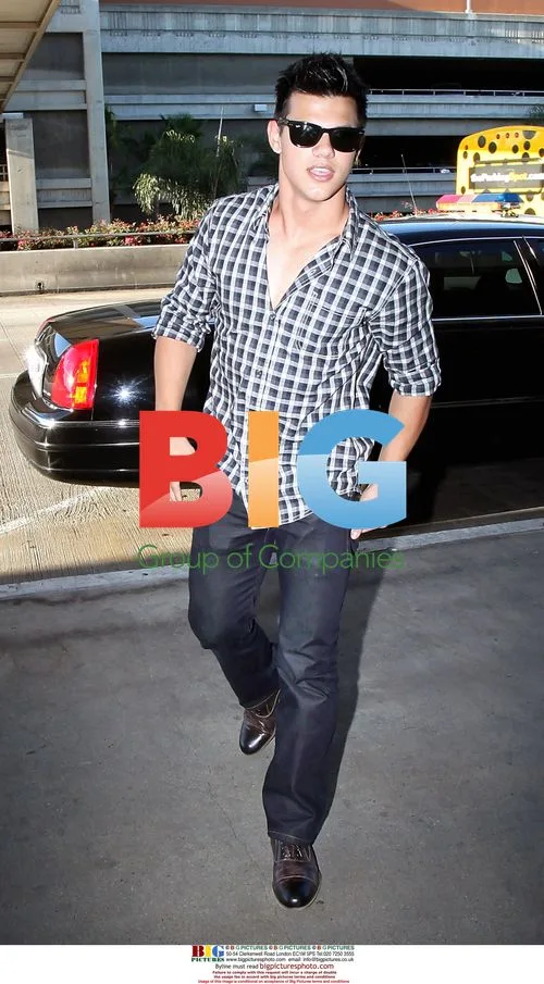 Taylor Lautner Arrives at LAX