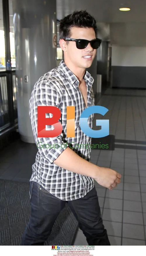 Taylor Lautner Arriving at LAX