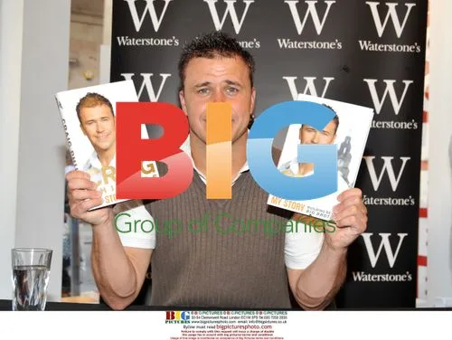 Craig Phillips signs book "My Story"