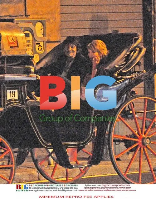 Ronnie Wood and Ekaterina Ivanova on a carriage ride in Rome