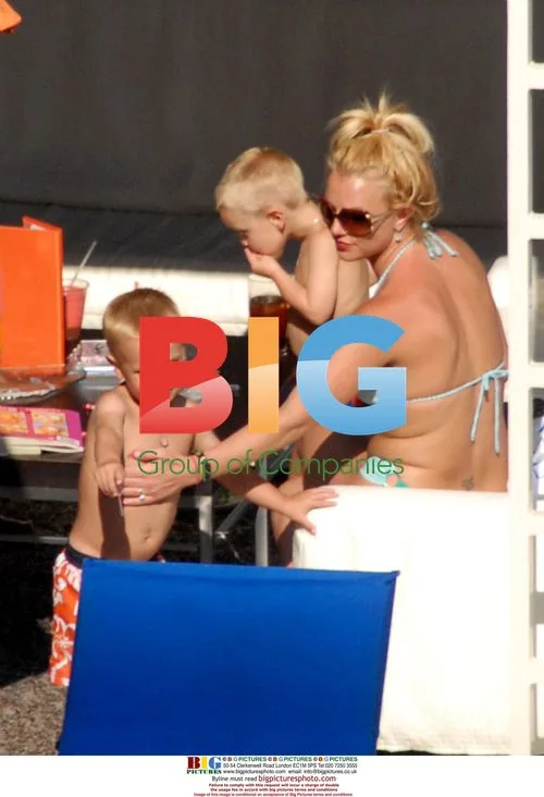 Britney Spears and sons by pool in LA