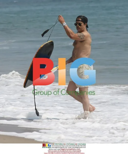 Slash from Guns N' Roses Boogie Boarding
