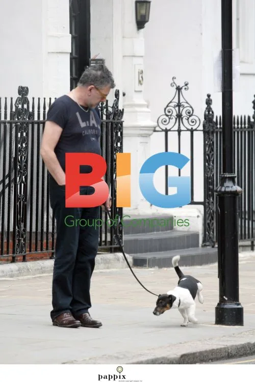 Jack Vettriano walks dog Nipper in London
