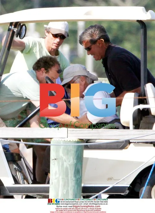 Ted Kennedy being helped onto boat