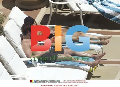 Kelly Brook and Danny Cipriani Poolside