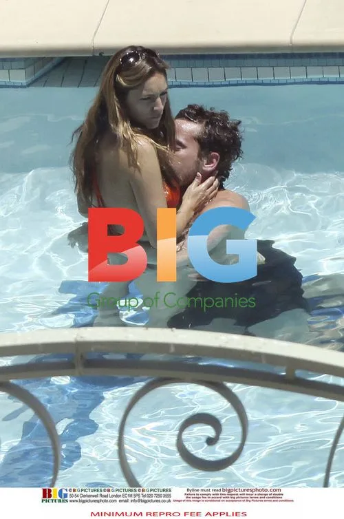 Kelly Brook and Danny Cipriani poolside