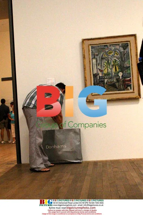 Graffiti artist "Don" hangs piece in Tate Modern
