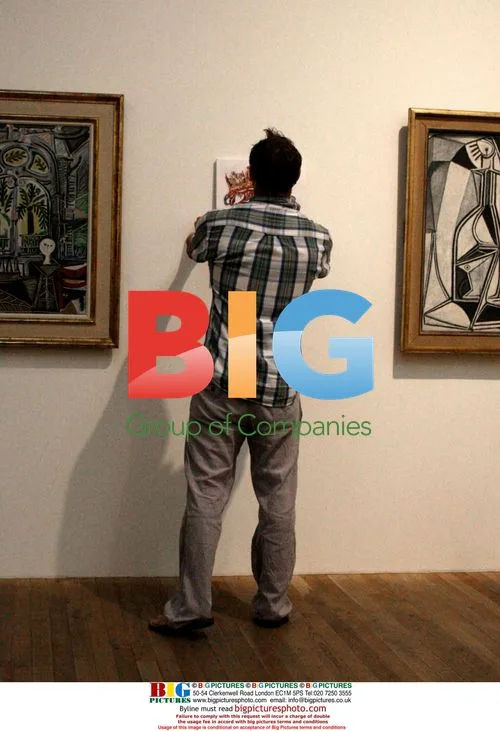 Graffiti artist 'Don' hangs piece at Tate Modern
