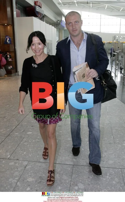 Andrea Corr and husband depart Heathrow