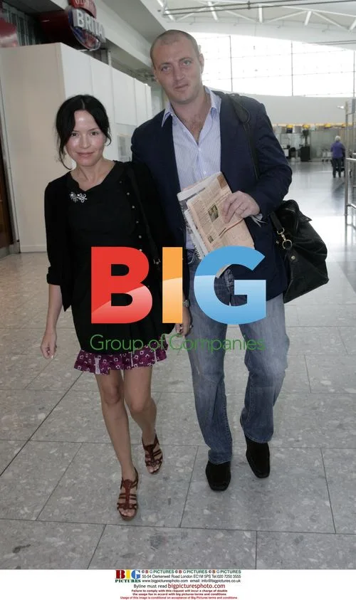 Andrea Corr and husband Brett Desmond at Heathrow