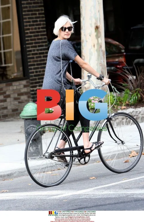Agyness Deyn cycling and shopping in Soho