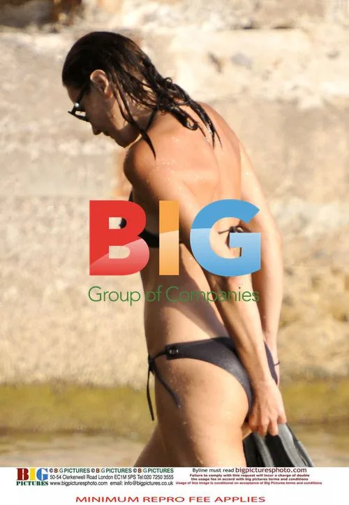 Sarkozy and Bruni Swim at Family Home
