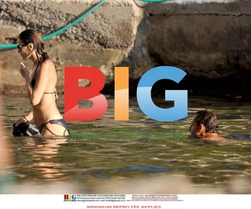 Sarkozy and Bruni Swim at French Home