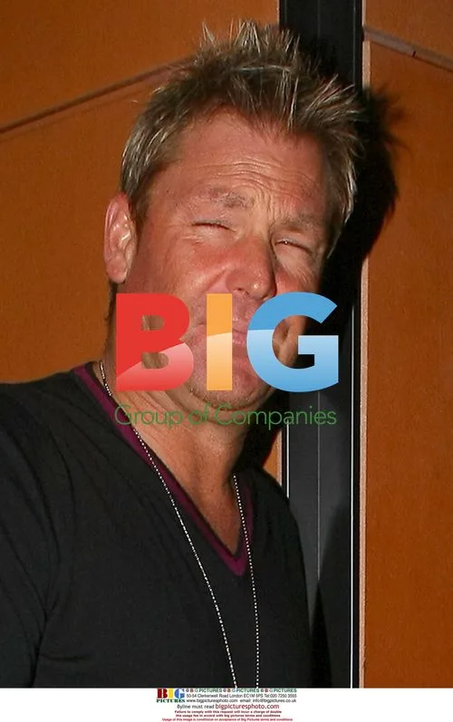 Shane Warne Flashes Smile After London Outing