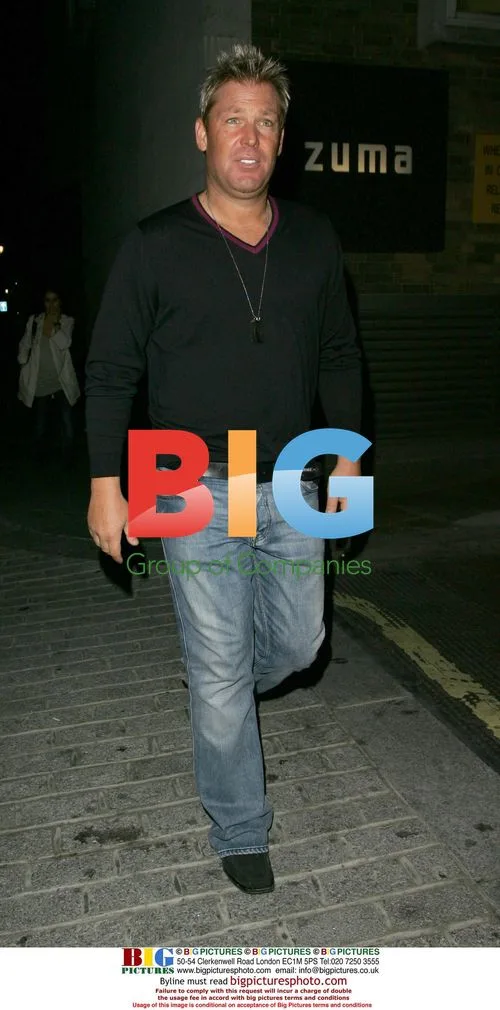 Shane Warne Flashes Smile After London Outing